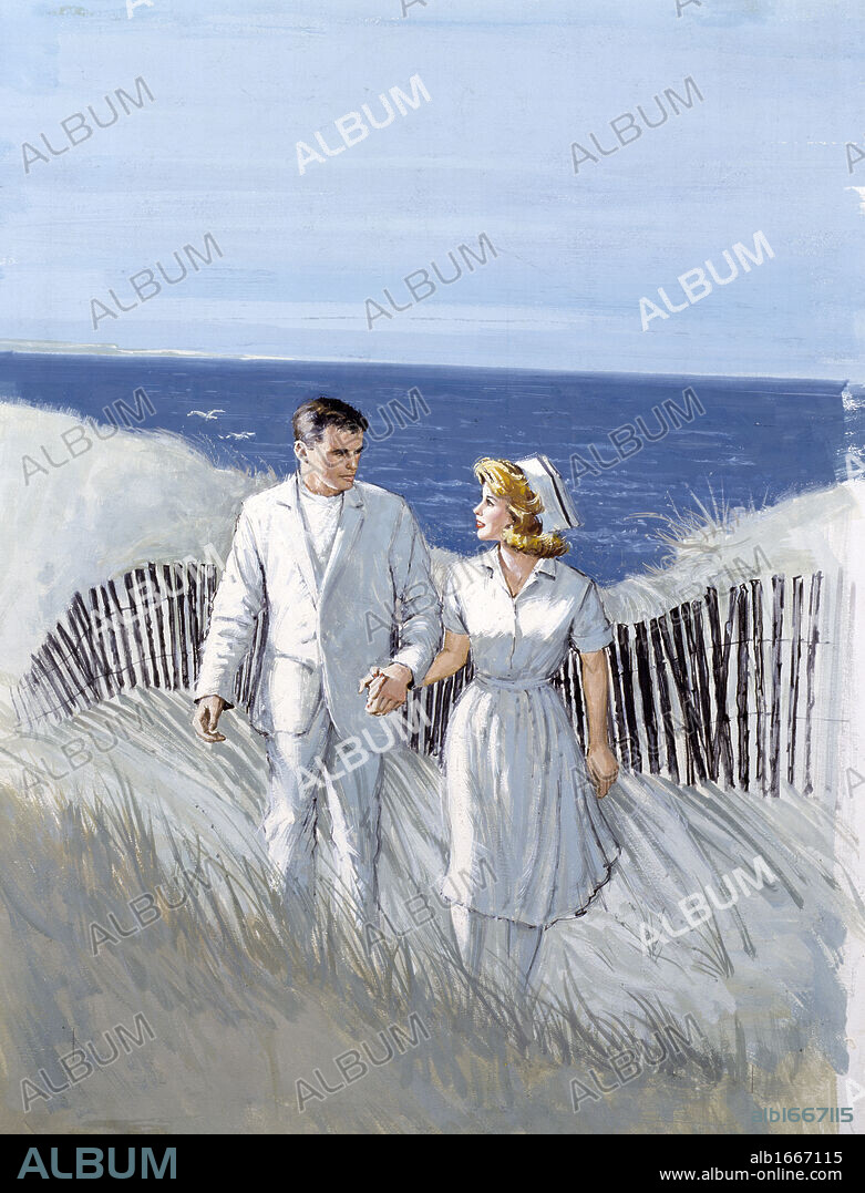 Couple walking on the beach.