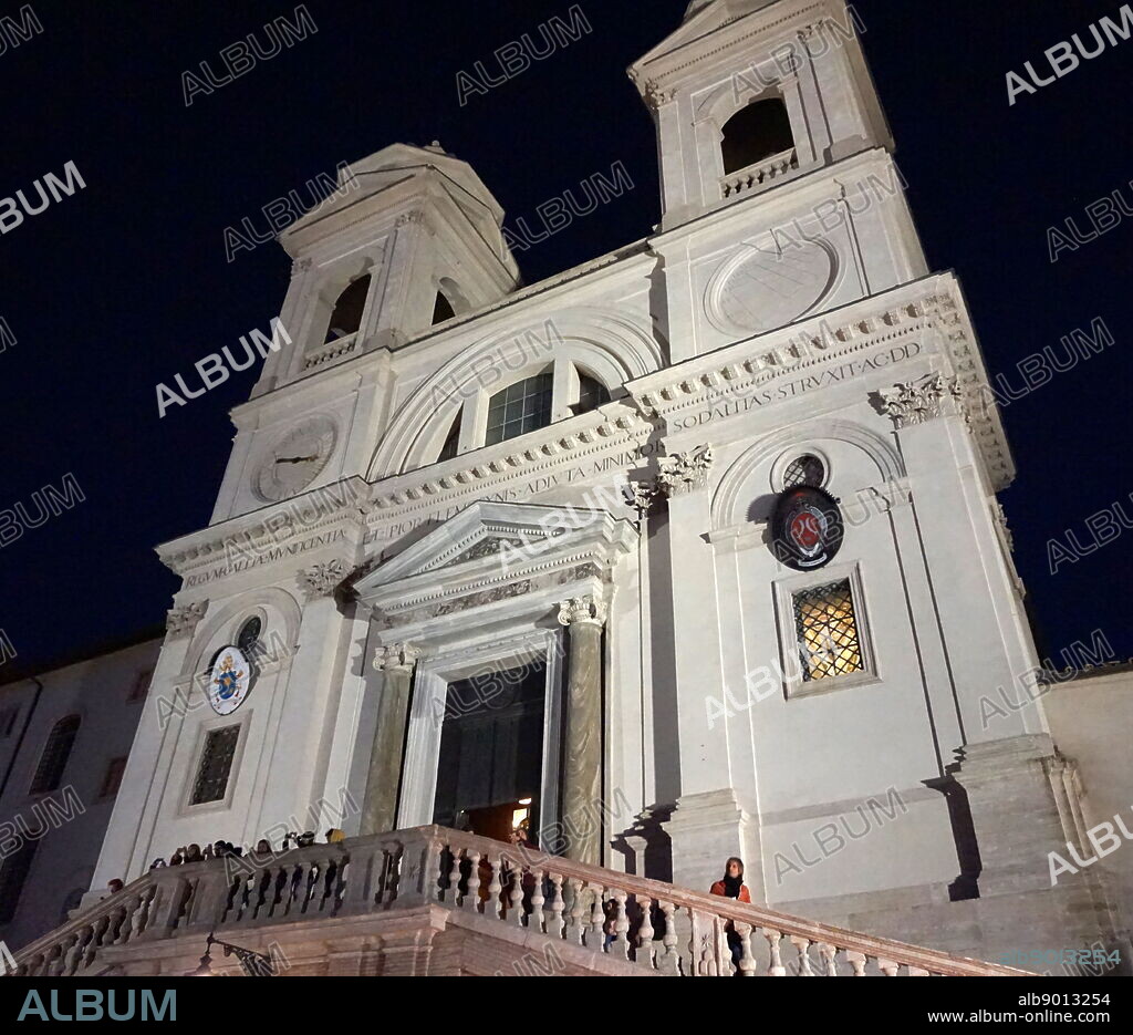 Exterior of the church of the Santissima Trinita dei Monti. a Roman Catholic late Renaissance titular church in Rome, central Italy. It is best known for its commanding position above the Spanish Steps which lead down to the Piazza di Spagna. The church and its surrounding area (including the Villa Medici) are the responsibility of the French State.