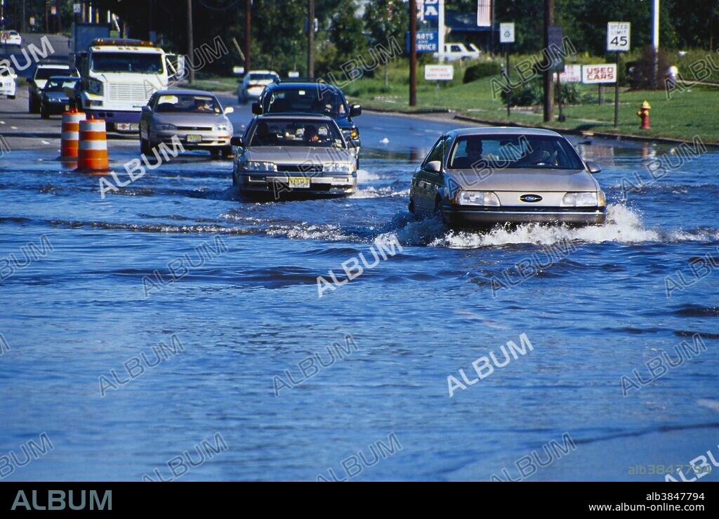 Hurricane Floyd Flooding. Vehicles pass through high water. Bloomfield Road, West Caldwell, New Jersey.