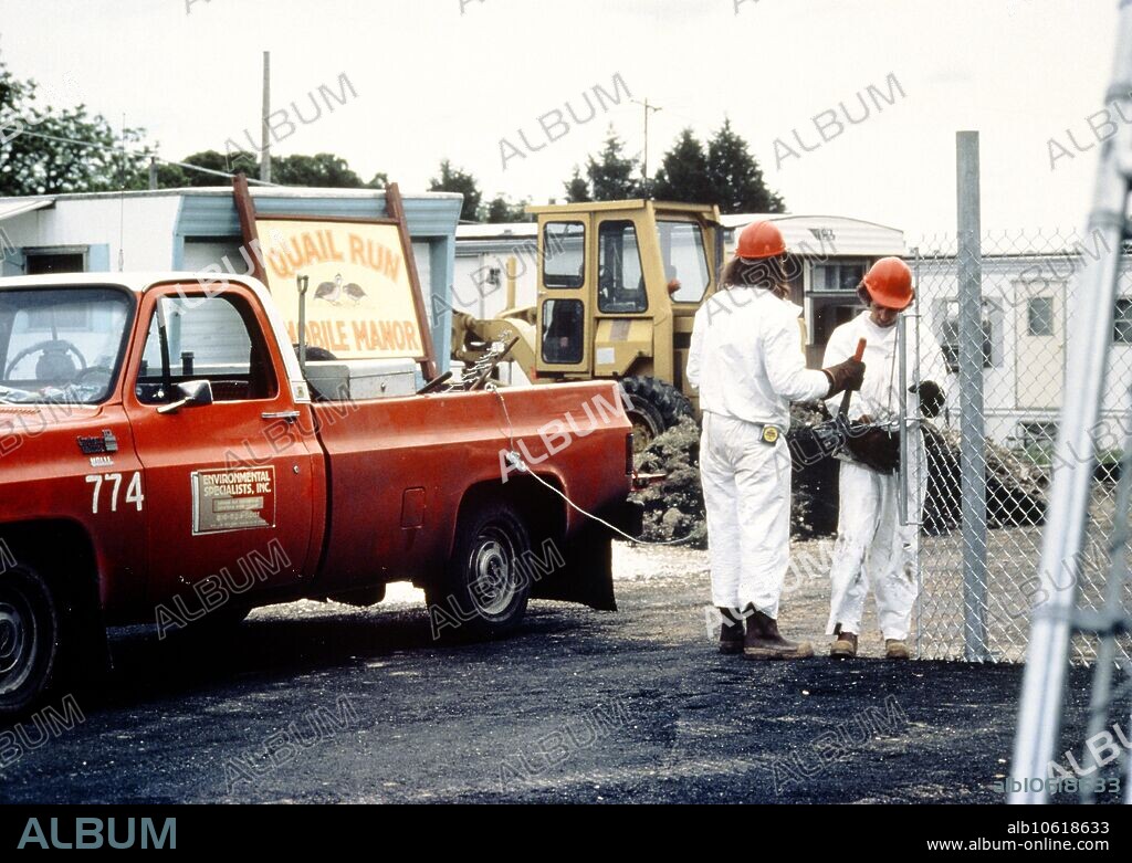 Times Beach, Missouri, town evacuated due to dioxin contamination of soil, showing environ- mentalist investigating.