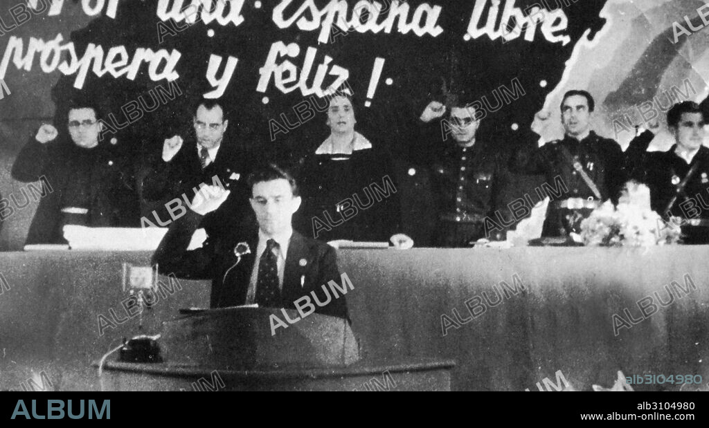 José Díaz Ramos (1896—March 19, 1942) Spanish trade unionist and communist politician addresses the Communist Party congress 1937. Behind him are other leaders including Santiago Carrillo and Dolores Ibarurri.