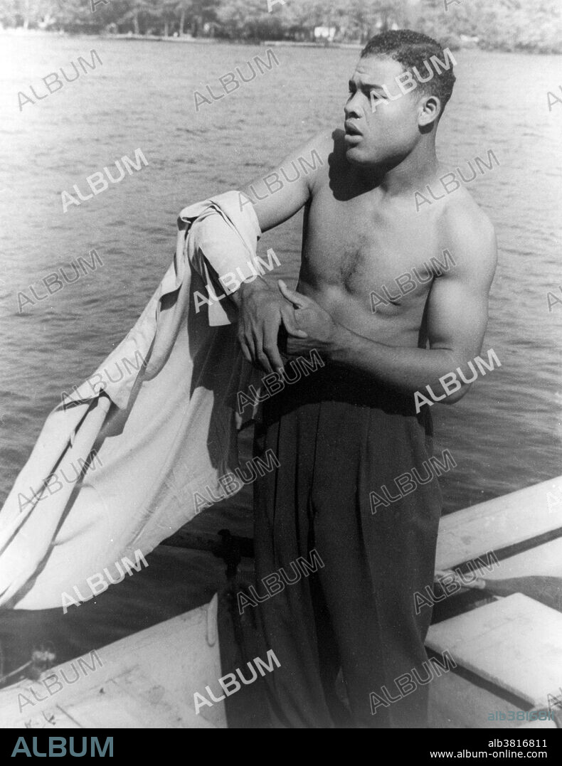 Entitled: "Joe Louis, Greenwood Lake, New York." Joseph Louis Barrow (May 13, 1914 - April 12, 1981) was an African-American professional boxer and the World Heavyweight Champion from 1937-49. He made 25 defenses of his Heavyweight title and was a world champion for 11 years and 10 months. Both are still records in the heavyweight division, the former in any division. In 2005, Louis was ranked as the #1 heavyweight of all-time by the International Boxing Research Organization, and was ranked #1 on The Ring's list of the 100 Greatest Punchers of All-Time. He is widely regarded as the first African-American to achieve the status of a nationwide hero within the USA, and was also a focal point of anti-Nazi sentiment leading up to and during WWII. He was instrumental in integrating the game of golf, breaking the sport's color barrier in America by appearing under a sponsor's exemption in a PGA event in 1952. He died of cardiac arrest in 1981, at the age of 66. President Reagan waived the eligibility rules for burial at Arlington National Cemetery and Louis was buried there with full military honors. His funeral was paid for in part by former competitor and friend, Max Schmeling, who also acted as a pallbearer. Photographed by Carl Van Vechten September 15, 1941.