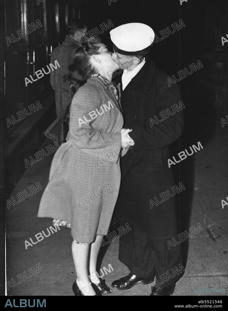 That " Halr-Way-Round-The-World" Kiss -- British Jack Tar, Fred Pomfield of Middlesborough greets his 16 year old Australian bride after a chase half way round the world. The couple married in Sydney after a lightening romance and When Mrs. Pomfield sailed for England she had a 9 days start  of her husband. But Fred beat her - and arrived home to find his bride "lost". She had waited for him in London. A call to the press from frantic Fred ended in the couple being reunited. July 04, 1946. (Photo by Mirror Features).