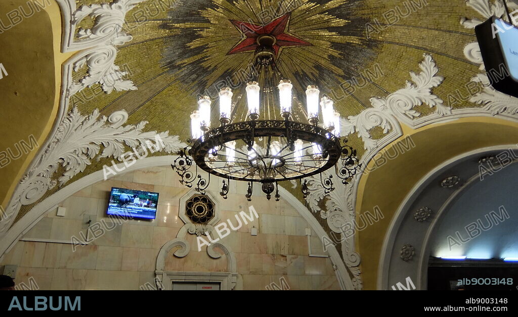 Komsomolskaya Metro station in the Krasnoselsky District, Moscow. The station is noted for its being located under the busiest Moscow transport hub, Komsomolskaya Square. the first southern segment of the Koltsevaya line is dedicated to the victory over Nazi Germany, the northern segment is dedicated to the theme of post-war labour. Komsomolskaya, however, is a clear exception: lead designer Alexey Shchusev designed it as an illustration of a historical speech given by Joseph Stalin November 7, 1941. In this speech, Stalin evoked the memories of Alexander Nevsky, Dmitry Donskoy and other military leaders of the past, and all these historical figures eventually appeared on the mosaics of Komsomolskaya.
