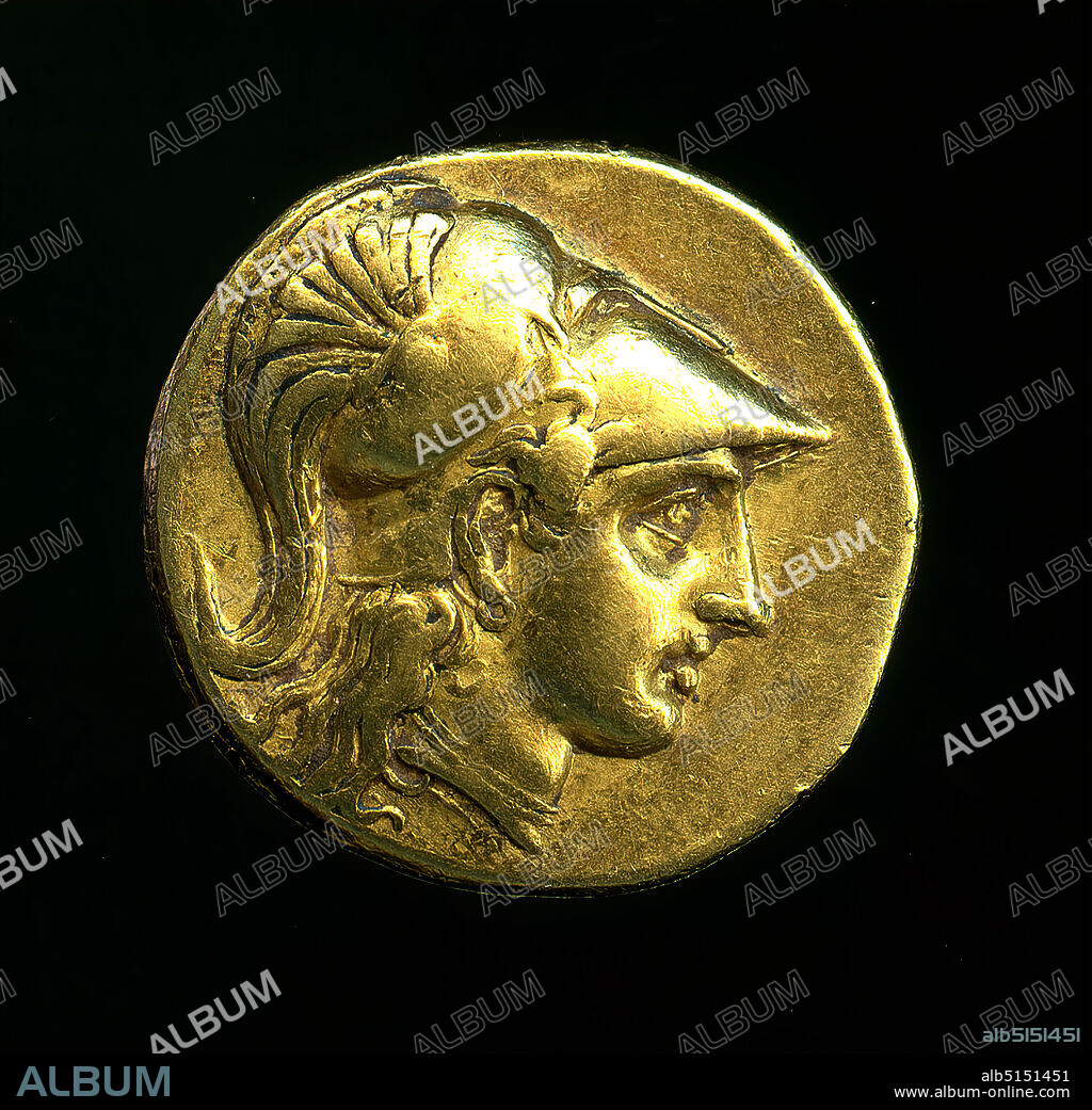 Stater Alexander the Great (Av: Athena, Rv: Nike), gold, cast, embossed, gold, embossed, Total: Diameter: 1.89 cm; Weight: 8.52 g, inscribed: Revers: , coins, numismatics, history of Minerva (Pallas, Athena), Late Classical (Greek antiquity), Greek antiquity, obverse: head of the goddess Athena with the Corinthian helmet pushed back to the left Reverse: The standing goddess of victory Nike in long robe and with outstretched wings, holding a wreath in her protruding right hand. With her left she embraces a stylo. In the left section there is a wreath with the ligature M(I)R at the bottom. Nike is framed by the inscription 'Alexandrou Basileos' running from top to bottom. The coin was probably minted in the mint of Babylon. Alexander the Great had conquered the city in 331 BC. This is a term post quem (after) the minting of the coin could take place at the earliest. But his successors also had this coin type minted until the end of the 4th century BC.