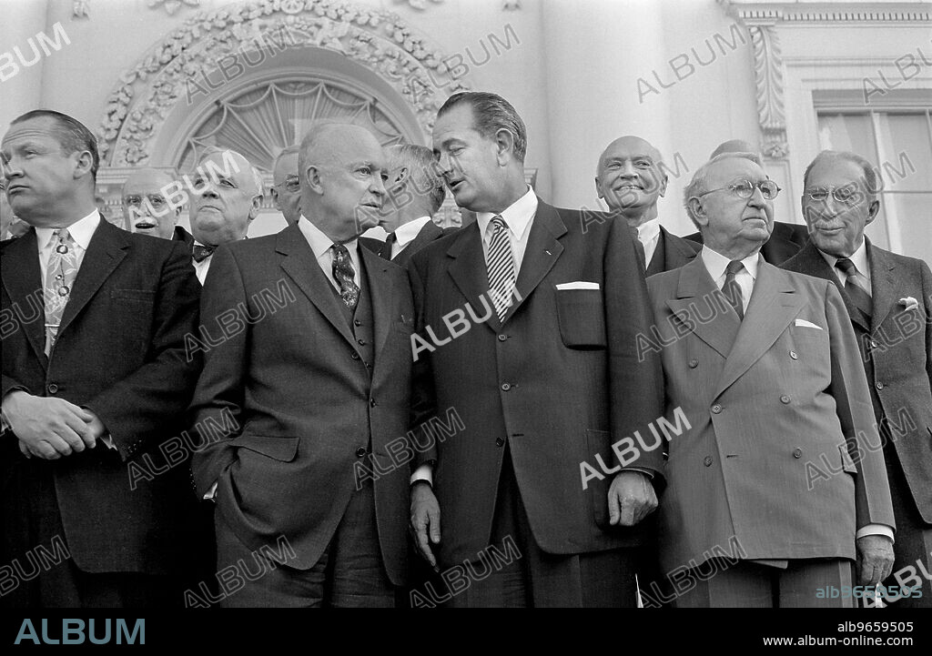 U.S. President Dwight D. Eisenhower standing with Lyndon B. Johnson (center), John Foster Dulles (right) and other guests, during Bipartisan Luncheon, White House, Washington, D.C., USA, photograph by Thomas J. O'Halloran, March 31, 1955.