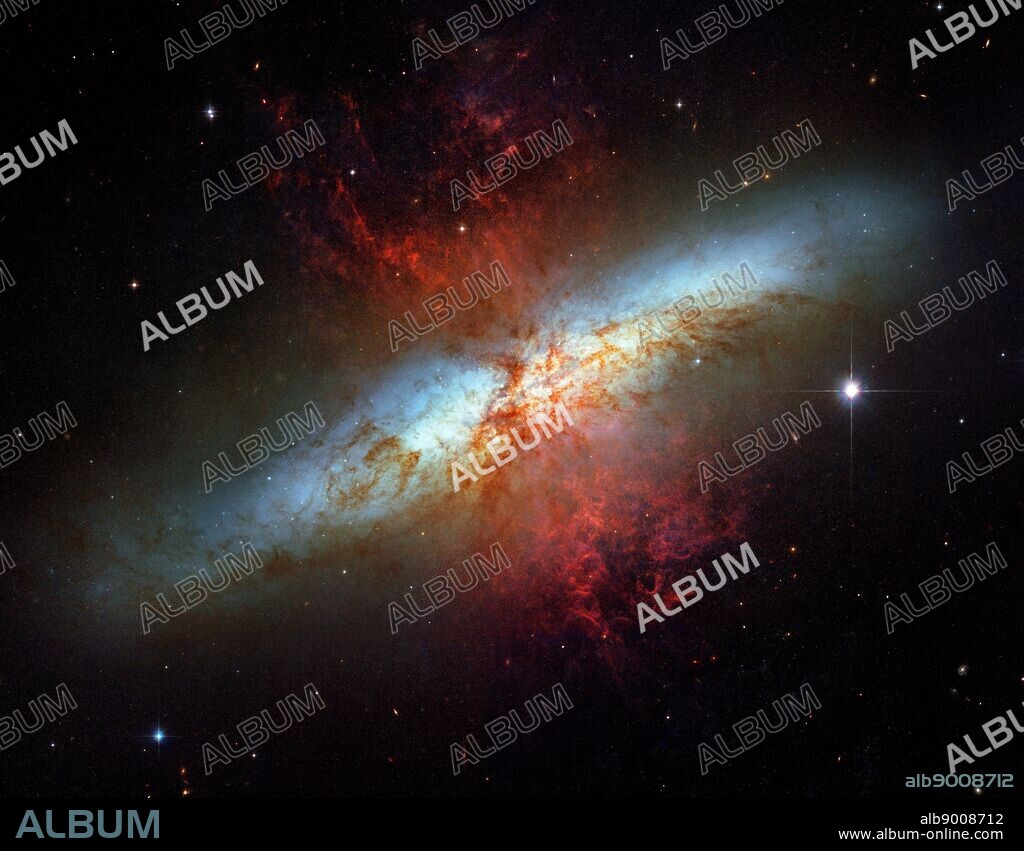 What's lighting up the Cigar Galaxy? M82, as this irregular galaxy is also known, was stirred up by a recent pass near large spiral galaxy M81. This doesn't fully explain the source of the red-glowing outwardly expanding gas, however. Recent evidence indicates that this gas is being driven out by the combined emerging particle winds of many stars, together creating a galactic super wind.. The above photographic mosaic highlights a specific colour of red light strongly emitted by ionized hydrogen gas, showing detailed filaments of this gas. The filaments extend for over 10,000 light years. The 12-million light-year distant Cigar Galaxy is the brightest galaxy in the sky in infrared light, and can be seen in visible light with a small telescope towards the constellation of the Great Bear (Ursa Major).