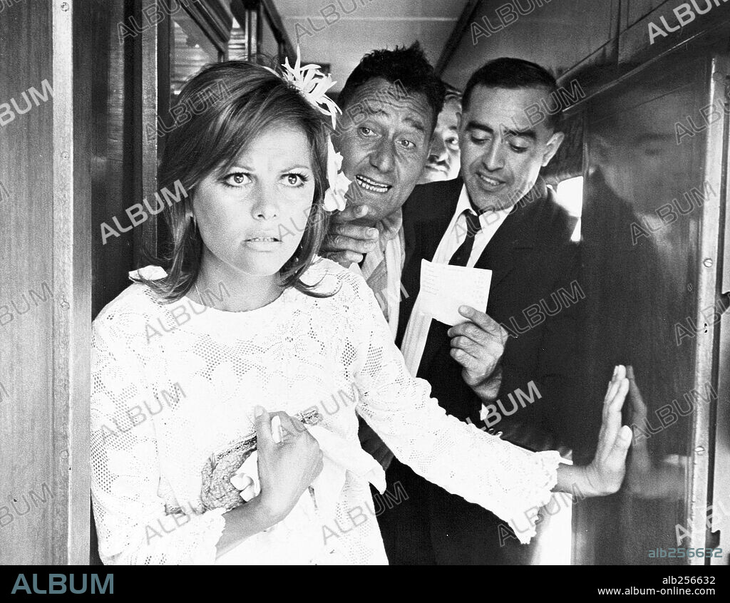 ALBERTO SORDI and CLAUDIA CARDINALE in A GIRL IN AUSTRALIA, 1971 (BELLO, ONESTO, EMIGRATO AUSTRALIA SPOSEREBBE COMPAESANA ILLIBATA). Copyright DOCUMENTO FILM/CCC FILMKUNST.
