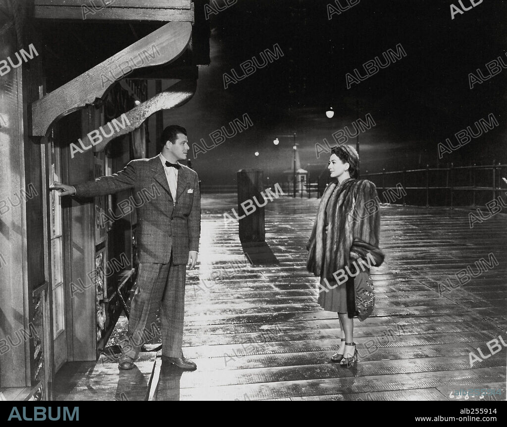 JACK CARSON y JOAN CRAWFORD en ALMA EN SUPLICIO, 1945 (MILDRED PIERCE), dirigida por MICHAEL CURTIZ. Copyright WARNER BROTHERS.