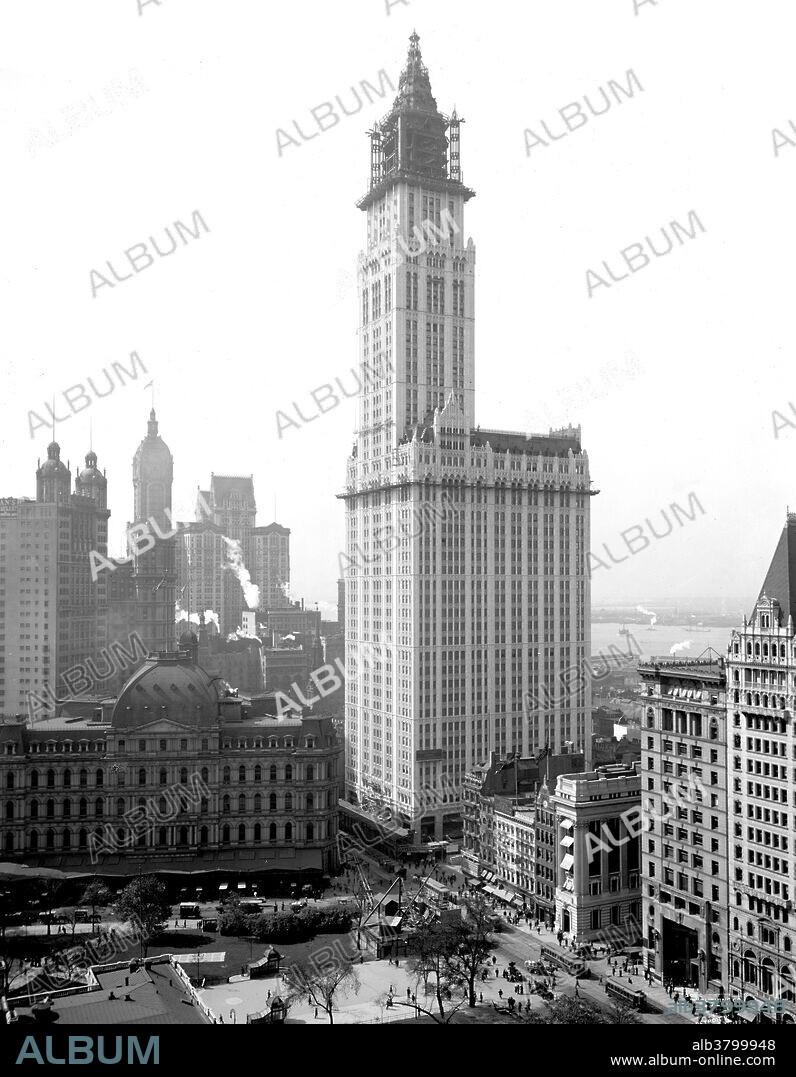 The Woolworth Building, at 233 Broadway, Manhattan, New York City, designed by architect Cass Gilbert in the neo-Gothic style commissioned in 1910 to design a 20 story office building as the F. W. Woolworth Company's new corporate headquarters on Broadway, between Park Place and Barclay Street in Lower Manhattan, opposite City Hall. Originally designed to be 420 feet high, the building was eventually elevated to 792 feet. At its opening, the Woolworth Building was 60 stories tall and had over 5,000 windows. The construction cost was US$13.5 million. More than a century after the start of its construction, it remains one of the 100 tallest buildings in the United States as well as one of the 30 tallest buildings in New York City. It has been a National Historic Landmark since 1966, and a New York City landmark since 1983. Photographed by the Detroit Publishing Company, 1913.