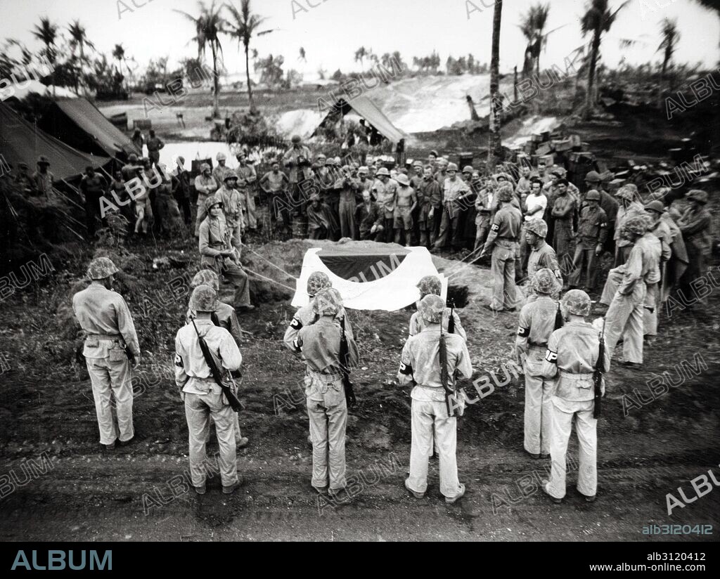 World War two: The funeral of Japanese general Yoshitsugu Saito, Saipan, 1944. Yoshitsugu Saito (1890 – 10 July 1944) lieutenant general in the Imperial Japanese Army during World War II. In April 1944, Saito was appointed commander of the IJA 43rd Division at the time of its deployment to Saipan. Saito, wounded by shrapnel, committed ritual suicide in a cave at dawn on 10 July, with his adjutant shooting him in the head after he had disembowelled himself.