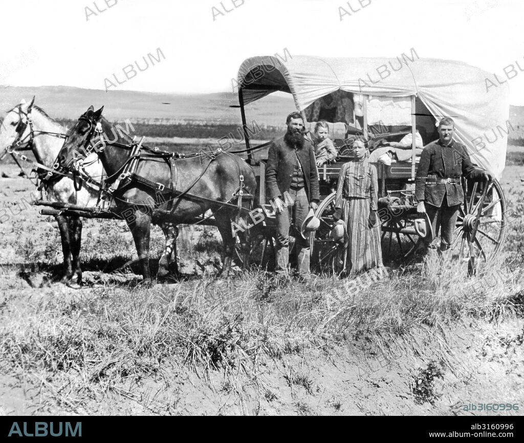 Loup Valley, Nebraska: 1886 A pioneer family and their covered wagon in the Loup Valley.