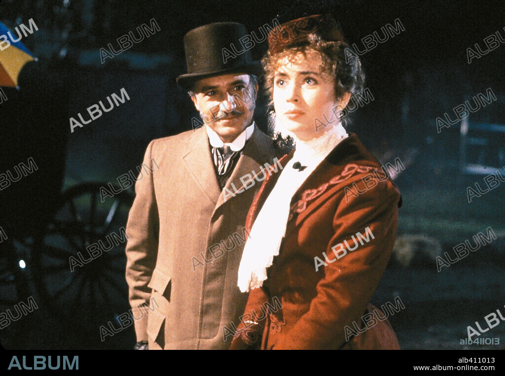 BEN KINGSLEY and LYSETTE ANTHONY in WITHOUT A CLUE, 1988, directed by THOM EBERHARDT. Copyright RANK / ATTWOOD, GRAHAM.