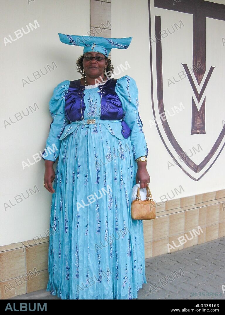 Namibia, Erongo, Swakopmund, Herero woman in blue dress, Herero woman with typical headdress. (Photo by: Julia Schmitz/Oneworld Picture/UIG).
