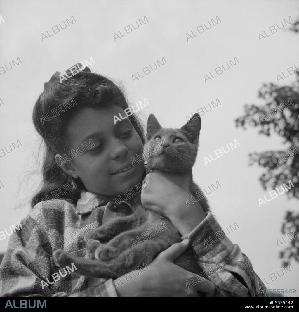 GORDON PARKS. Arden, New York. Interracial activities at Camp Gaylord White, where children are aided by the Methodist Camp Service. The camp mascot.