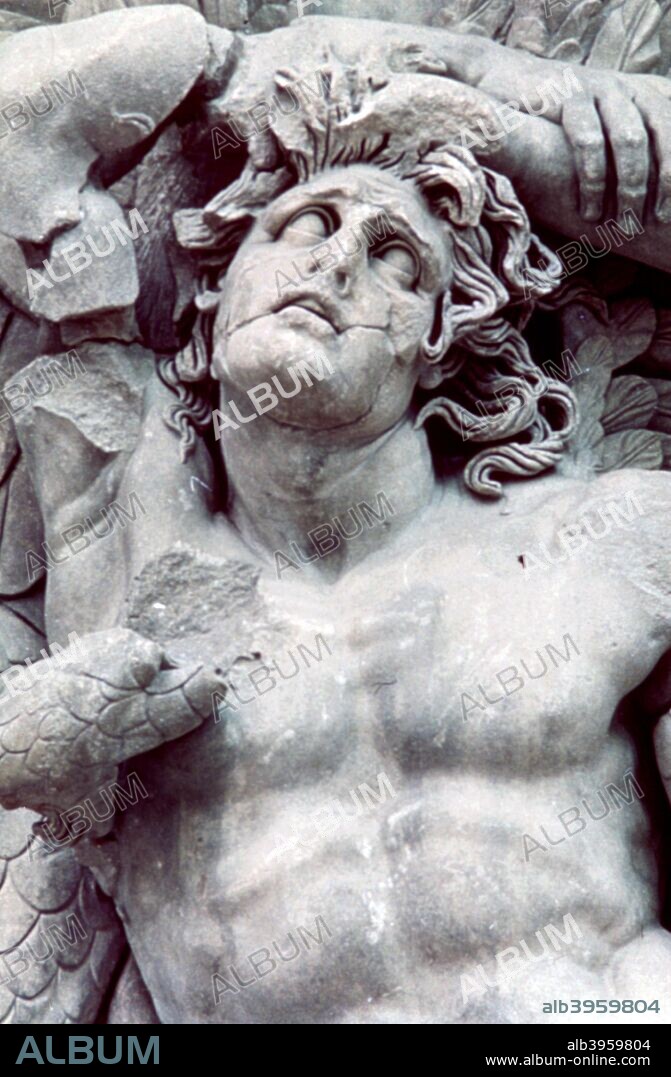 Detail from the Great Frieze of the Pergamon Altar, 180-159 BC. Part of the Athena Group; Athena, a giant and Gala. The 113 metre long Ancient Greek frieze depicts the 'gigantomachy', the struggle between the gods and the giants. From the Pergamon Museum, Berlin, Germany.