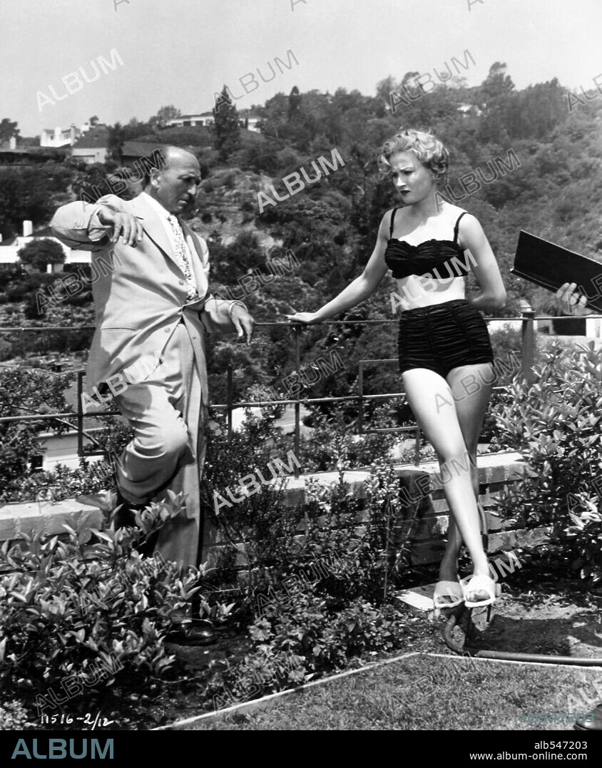 CAROL OHMART and MICHAEL CURTIZ in THE SCARLET HOUR, 1956, directed by MICHAEL CURTIZ. Copyright PARAMOUNT PICTURES.