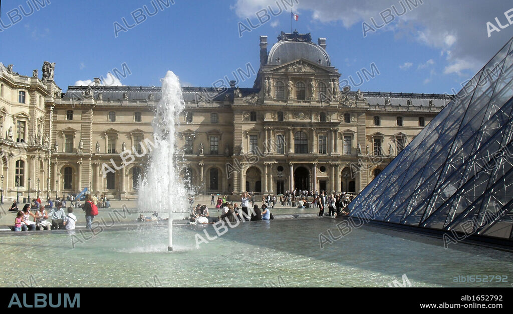 Louver Museum exterior of with part of the 'Louvre Pyramid' at the Louvre museum, Paris France. Designed by I. M. Pei.