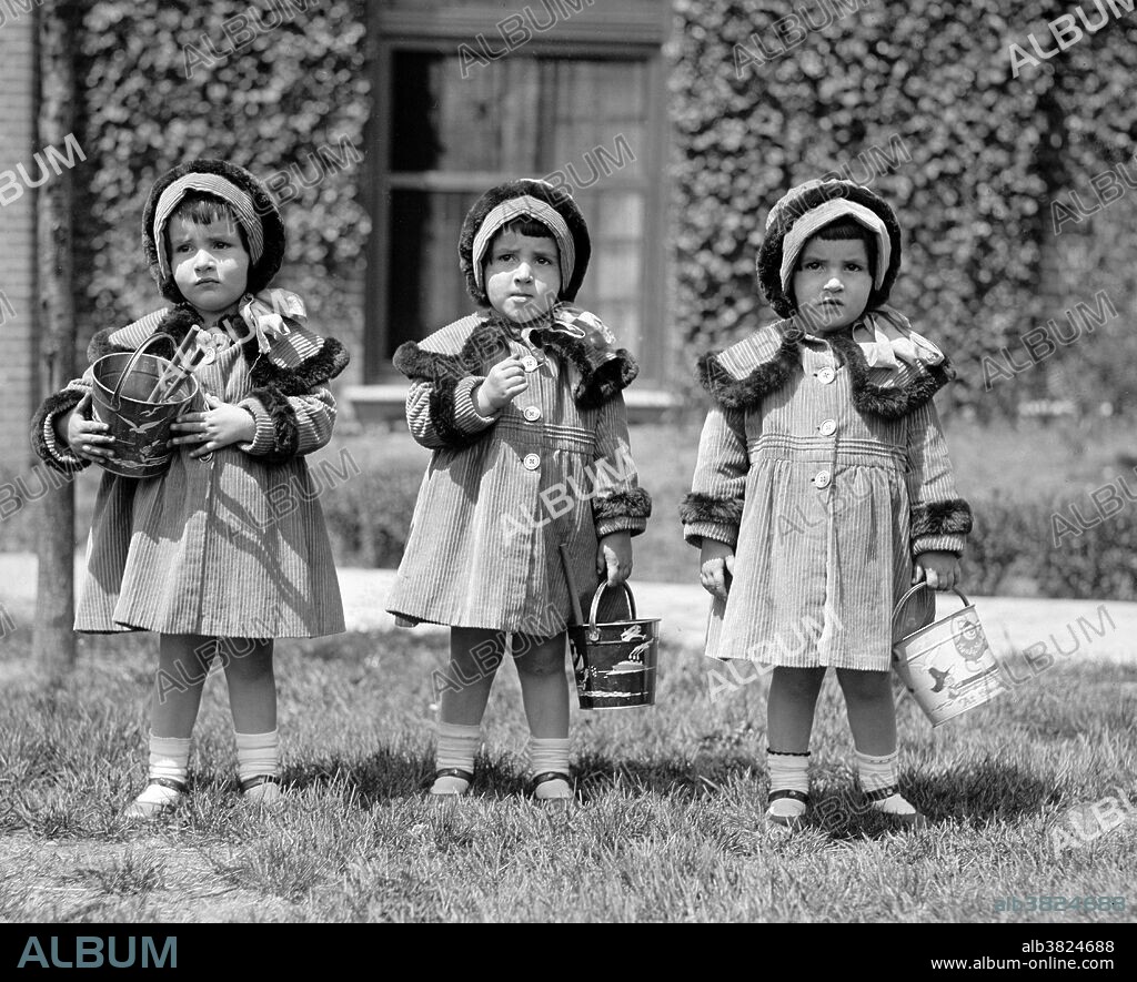 Editorial use only . Entitled: J.E. Boyd triplets . The Del Rubio triplets were born as the Boyd triplets (Edith, Elena and Mildred Boyd) on August 23, 1921 in the Panama Canal Zone. Their stage name comes from the colour they dyed their hair; the word rubio means blonde in Spanish. They were an American variety/musical act. They first achieved fame in the US in the 1950s, when they were popular night club performers, appearing often on television, including several Bob Hope programs on NBC. The Del Rubio Triplets made a comeback in the 1980s due to their campy style of dress and their goofy interpretations of standards and songs of the era. Photographed by the National Photo Company, May 3, 1924.