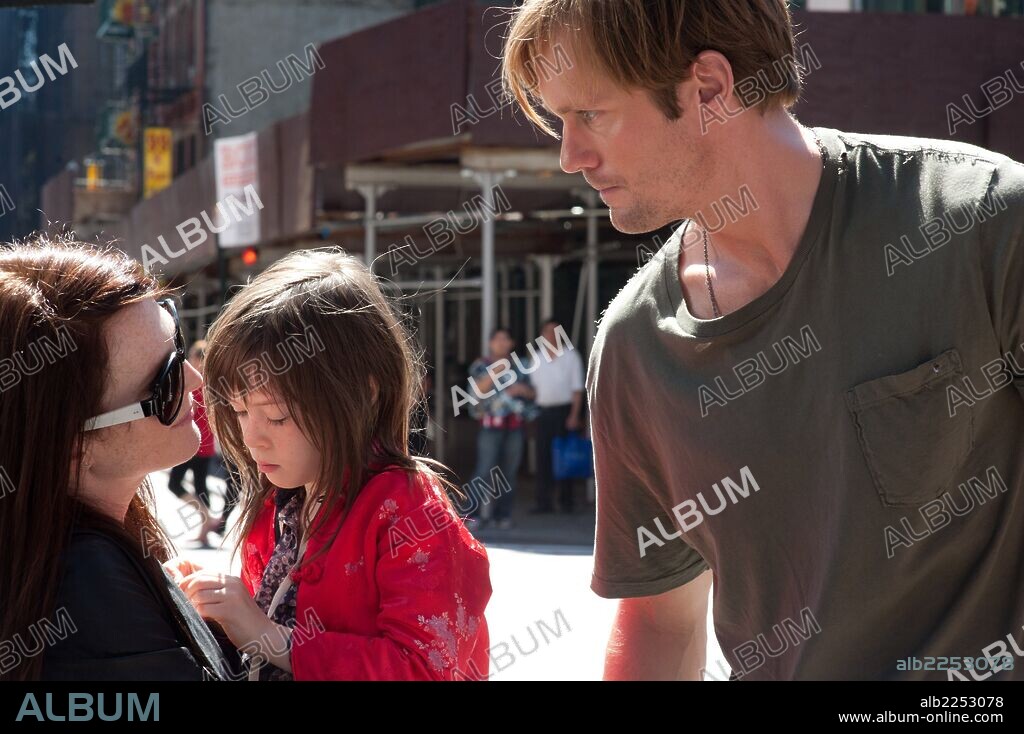 ALEXANDER SKARSGARD, JULIANNE MOORE and ONATA APRILE in WHAT MAISIE KNEW, 2012, directed by DAVID SIEGEL and SCOTT MCGEHEE. Copyright RED CROWN PRODUCTIONS.