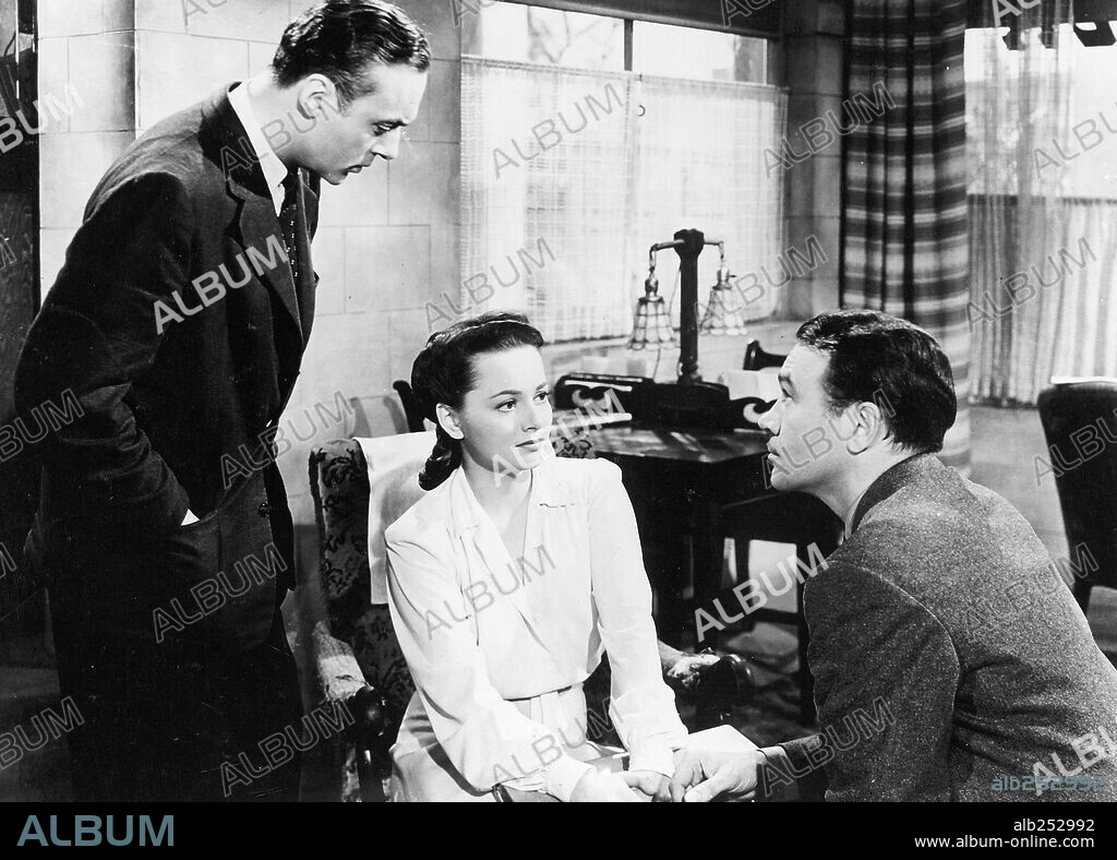 CHARLES BOYER, OLIVIA DE HAVILLAND and WALTER ABEL in HOLD BACK THE DAWN, 1941, directed by MITCHELL LEISEN. Copyright PARAMOUNT PICTURES.