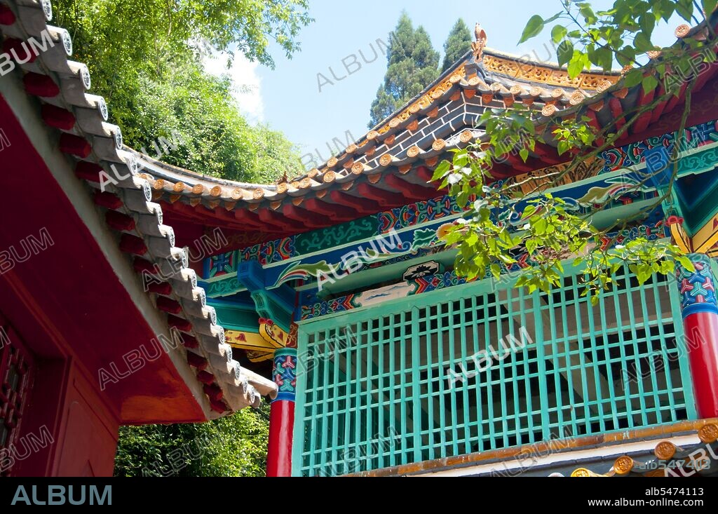 Lying 15 km west of Kunming City, the Dragon Gate (Long Men) in the Western Hills is close to the west shore of Dianchi Lake. It consists of the Sanqing Temple Complex and the Dragon Gate Grotto Complex. Dragon Gate is over 2,300 meters, 300 meters higher than the water surface of Dianchi Lake. Western Hills Forest Reserve (simplified Chinese: ??????; traditional Chinese: ??????; pinyin: Xi Shan Senlín Gongyuán) lies in the Biji Mountain chain to the west of Kunming, China. It is visible from the eastern or northern banks of Dianchi Lake.
