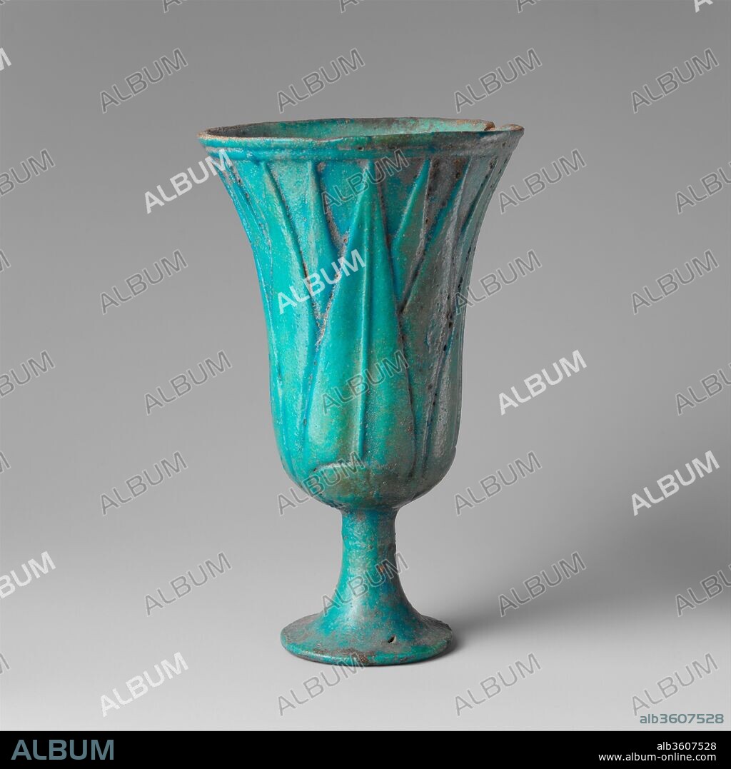 Lotiform Cup. Dimensions: H. 15 (5 7/8 in); diam. 9. 1 cm (3 9/16 in). Dynasty: Dynasty 19. Date: ca. 1295-1185 B.C..
The symbolism of this lotus-shaped chalice may reflect either an association with the water lily's analgesic properties, or with the plant's aquatic habitat.