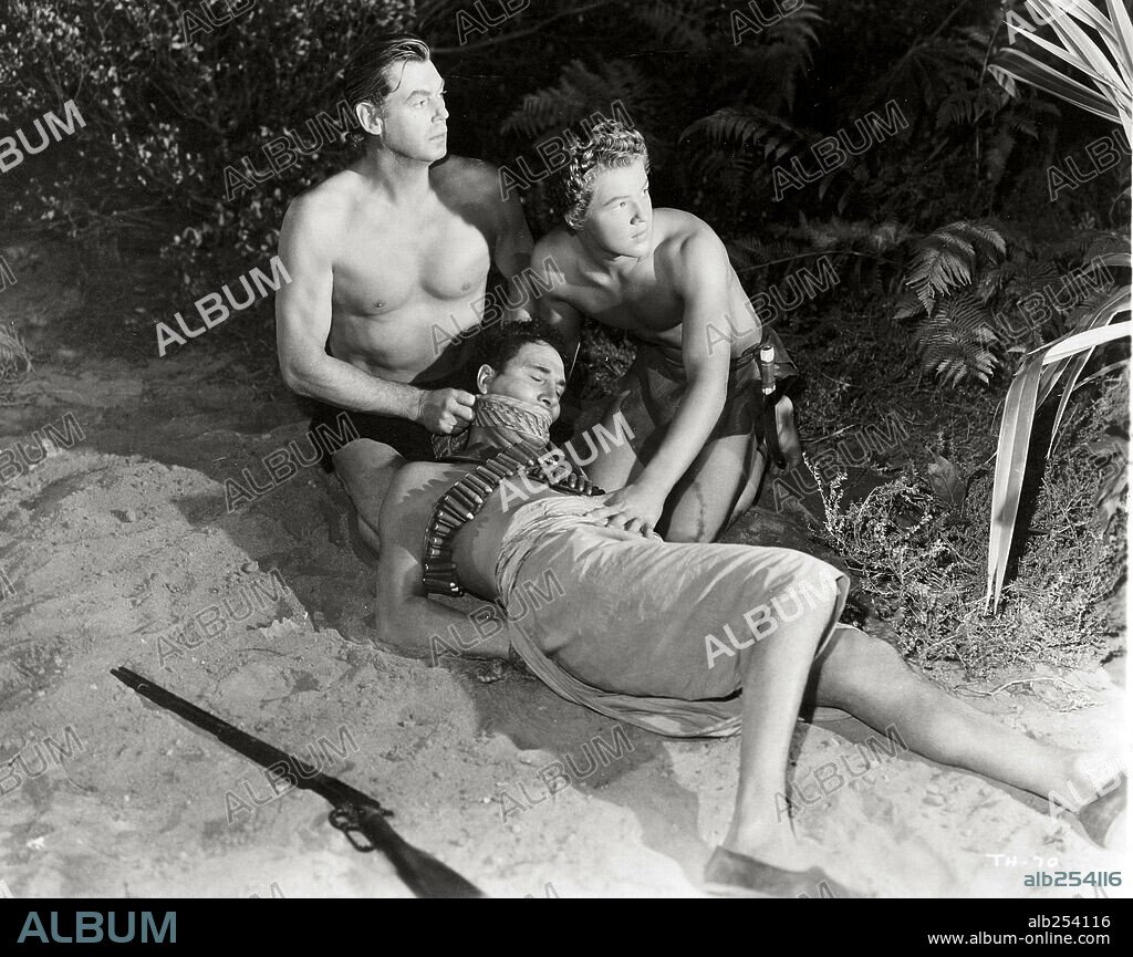 JOHNNY SHEFFIELD and JOHNNY WEISSMULLER in TARZAN AND THE HUNTRESS, 1947, directed by KURT NEUMANN. Copyright RKO.