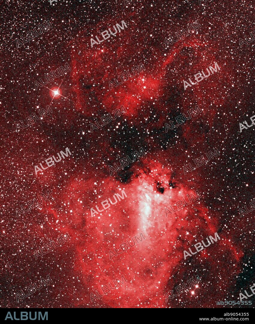 This visible-light view of the sky highlights the bright M17 nebula, as well as the glowing hot gas filling the 'bubble' to its left. Spitzer.
