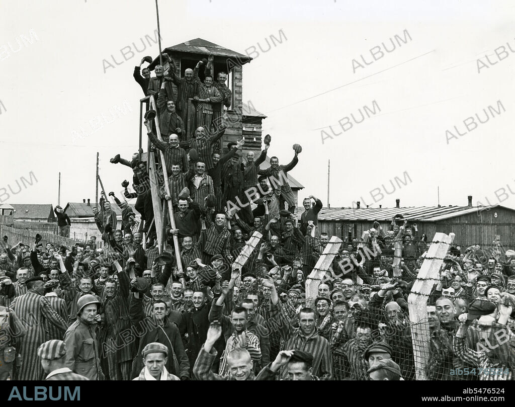 Newly liberated prisoners of the Allach concentration camp celebrate their liberation near Dachau, Germany, April 30, 1945.