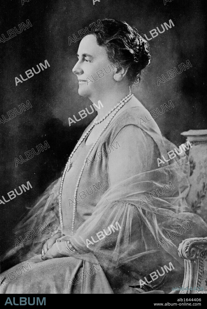 Wilhelmina (Wilhelmina Helena Pauline Maria: 1880-1962)  Queen regnant of the Kingdom of the Netherlands from 1890-1948. Three-quarter length profile photographic portrait of Queen Wilhelmina seated.