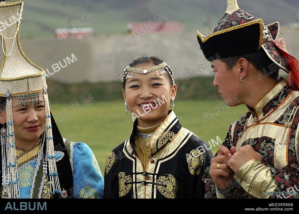 Two women and a man wearing traditional Mongolian national costumes, Ulan Bator or Ulaanbaatar, Mongolia, Asia.
