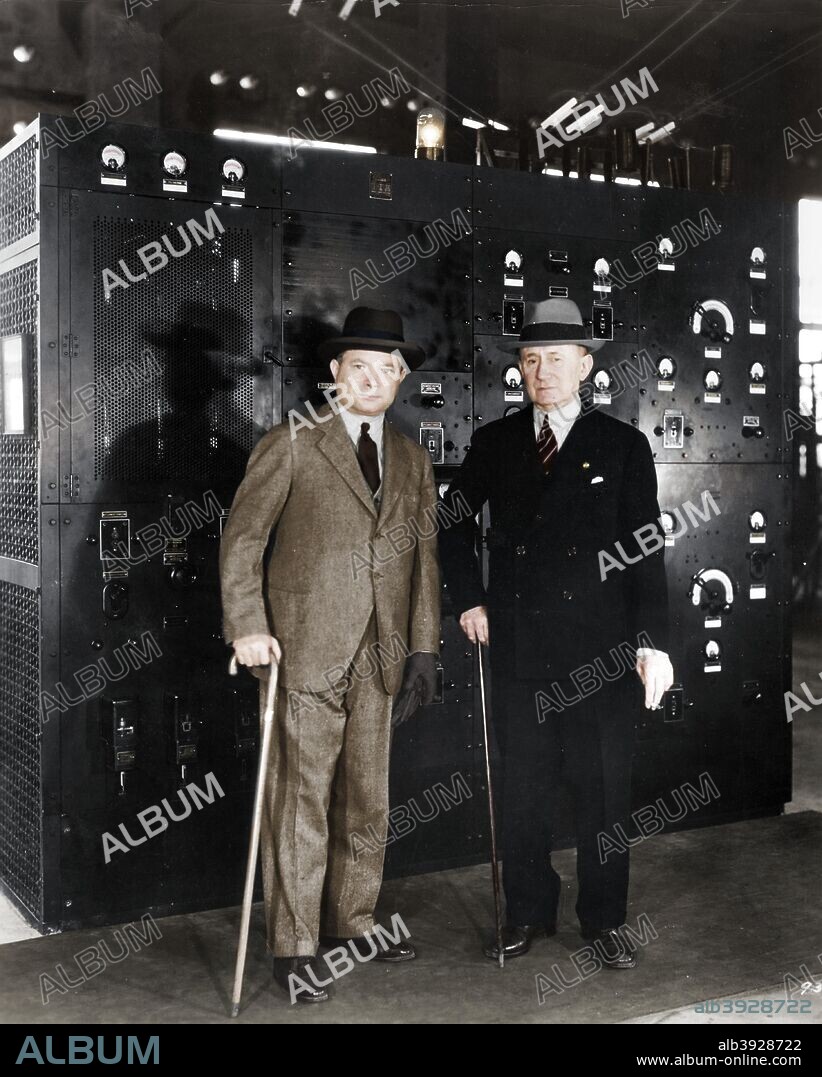 Guglielmo Marconi and David Sarnoff, 1933. Guglielmo Marconi (1874-1937) Italian radio pioneer, right, and David Sarnoff (1891-1971) Russian-born American pioneer of radio and television broadcasting, at RCA's 'Radio Central', Riverhead, Long Island, New York. (Colorised black and white print).