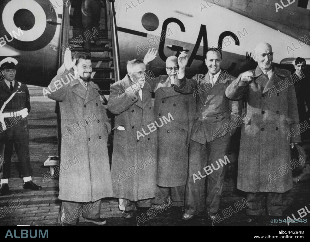 Britons Arrive From Moscow -- Left to Right, in front of the Royal Air Force Hastings plane that brought them from Moscow, are: George Blake: Bishop A.C. Cooper; Herbert Lord, Salvation Army Commander; Norman Owen and Monsignor Thomas Quinlan, Irish Priest, two of other members of the party captain Vyvyan Holt, former British representative in Seoul, and Philip Dean, a London Newspaper correspondent, are not shown in this group. Six Britons and an Irish Priest arrived in free West Berlin April 21 by plane from Moscow on their way from North Korean Internment. When they stepped off the plane at Gatow, the British Military airport in the British sector of Berlin, they were on free Western soil for the first time in 32 months. April 21, 1953. (Photo by Associated Press Photo).