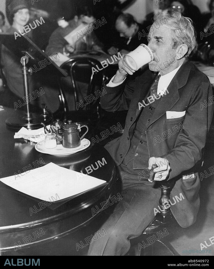 Orig. bildtext... BREAKFAST BEFORE BUSINESS FOR ALFALFA BILL Governor William H. Murray of Oklahoma was scheduled to appear before the House Ways and Means Committee in Washington D.C. on Jan. 18th., at a certain time, but he overslept. When he arrived at the meeting, Alfalfa Bill wouldn't testify until he had his morning coffee, so members of the committee sat back and watched him eat breakfast. Here he is partaking of refreshment, while he held the committee up at least ten minutes. 1/18/32 Anm W Murray, 1869-1956, amerikansk jurist och politiker, guvernör i Oklahoma 1930-1934. Cigarrer Frukost Klackringar CD686 persons: WILLIAM HENRY DAVIS MURRAY sites: WASHINGTON D C;USA.