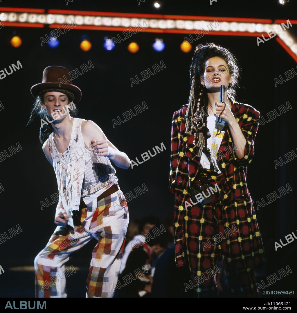 Haysi Fantayzee, British new wave band with Jeremiah Healy and Kate Garner, TV performance in 1982. Haysi Fantayzee, British new wave band with Jeremiah Healy and Kate Garner, TV performance in 1982.