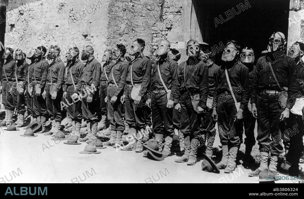 U.S. Marines standing in ranks with gas masks attached. France, 1918. The first use of poison gas on the Western Front was on April 22, 1915, by the Germans at Ypres, against Canadian and French colonial troops. The British Royal Society of Chemistry claims that British scientist Edward Harrison developed the first practical gas mask for mass production towards the end of 1916. American chemist and inventor James Bert Garner is credited by American sources with the invention of the gas mask in April 1915. He remembered experiments he had performed while teaching at the University of Chicago, thus he set about creating the first gas mask which he tested on two of his associates in a gas filled chamber. Following the successful completion of the test, he provided the results to the British government. Since dogs were frequently used on the front lines, a special type of gas mask was developed that dogs were trained to wear. Additionally, gas masks were developed during World War One and the time following for horses in the various mounted units that operated near the front lines.