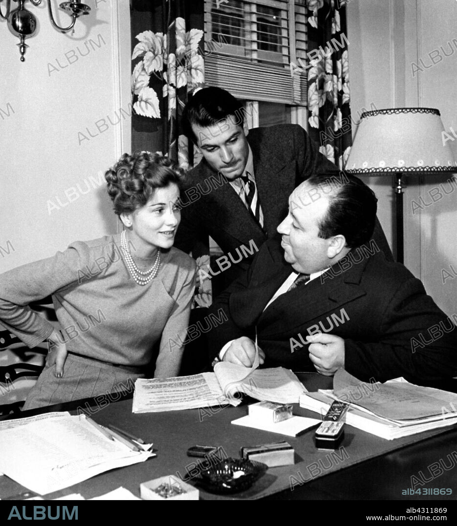 ALFRED HITCHCOCK, JOAN FONTAINE and LAURENCE OLIVIER in REBECCA, 1940, directed by ALFRED HITCHCOCK. Copyright Selznick International Pictures.