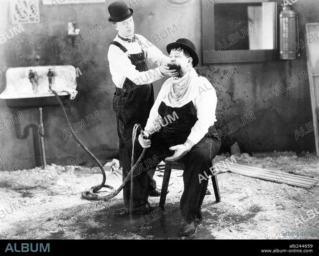 OLIVER HARDY and STAN LAUREL in BUSY BODIES, 1933, directed by LLOYD FRENCH. Copyright HAL ROACH/MGM.