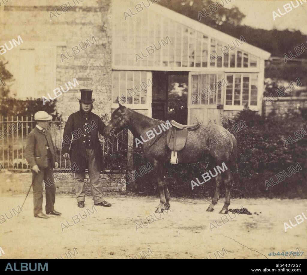 Man wearing top hat, holding horse, young boy in cap and walking stick next to man, Unknown, about 1870, Albumen silver print.