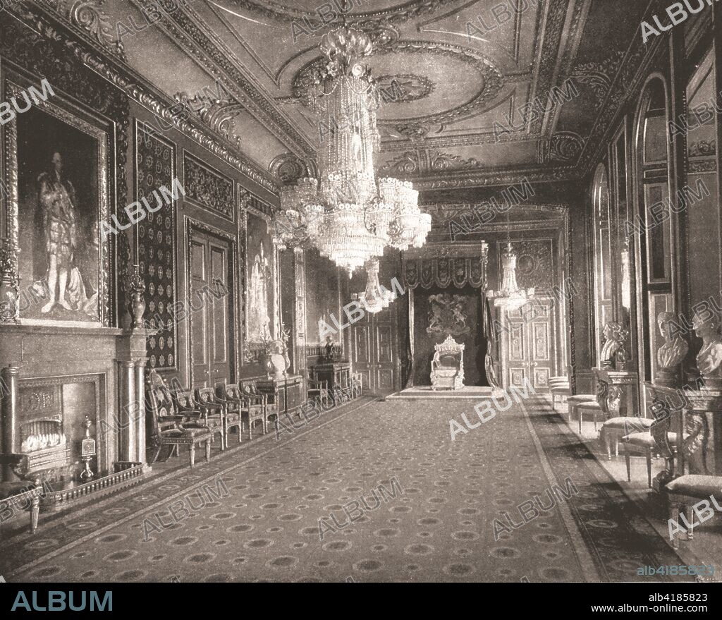 The Throne Room, Windsor Castle, Berkshire, 1894. The Garter Throne Room in the royal residence at Windsor, with a full-length portrait of King George III in garter robes by Gainsborough Dupont over the fireplace. The painting is surrounded by floral wooden carvings by Gringling Gibbons, with panels of garter-pattern wallpaper. From Beautiful Britain; views of our stately homes. [The Werner Company of Chicago, 1894].