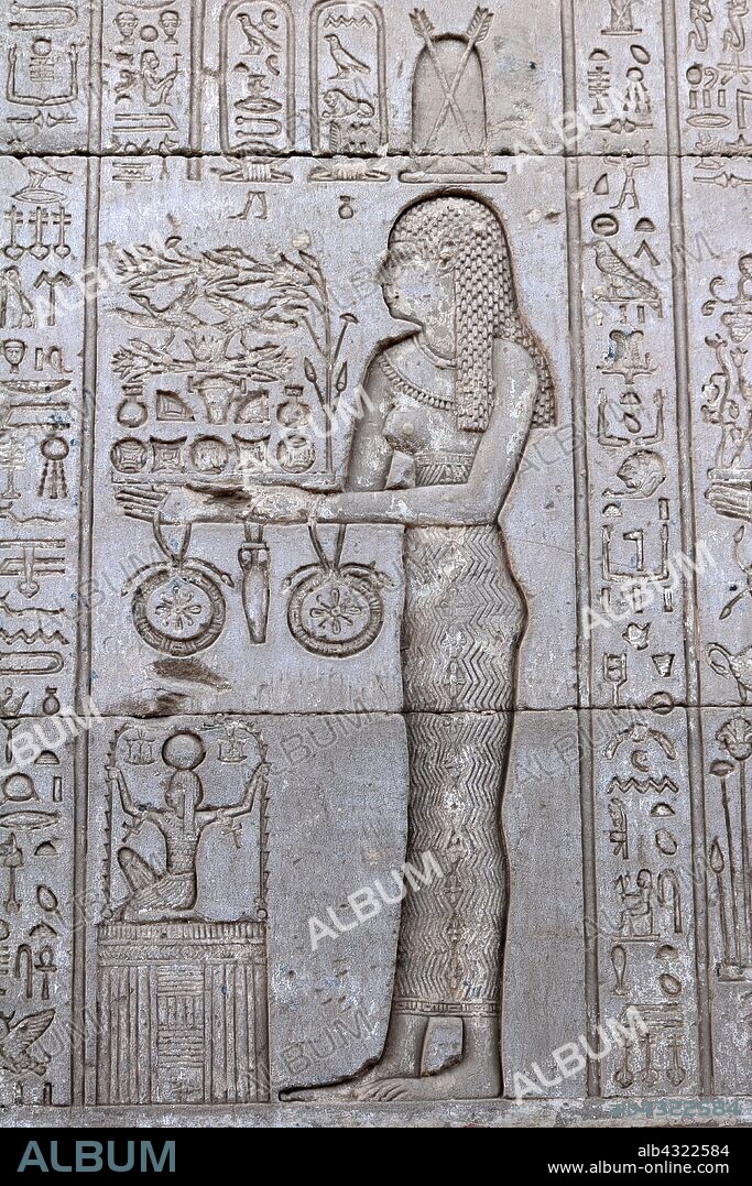 Carving at the Temple of Hathor, Dendera, Egypt. The Goddess Neth, Neith (Nit, Net, or Neit), an early goddess in the Egyptian pantheon, said to be the first and the prime creator.
