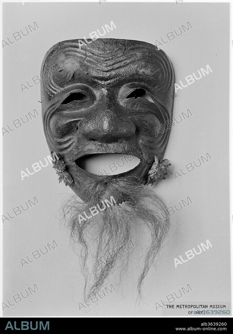 Mask (Somen). Culture: Japanese. Dimensions: H. 7 3/16 in. (18.3 cm); W. 5 3/4 in. (14.6 cm). Date: possibly 15th century.
This is one of the earliest surviving examples of a full face mask (somen). It is also very rare for being modeled on a specific character from Noh drama: the happy old man (okina) with distinctive white eyebrows and beard.