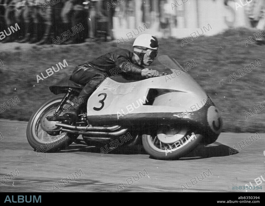 Duke Does it Again - Reg Armstrong of Australia piloted his Gilera to third place in the 500 C.C. Race at Hockenheim, behind Geoff Duke and Ken Kavanagh.
Geoff Duke, Britain's World 500 CC Motorcycle Champion Robe his 500 CC Gilera to victory in the Rhine cup races at Hockenheim, Germany on Sunday.
More than 120,000 fans saw him set up a lap record of 123.83 miles an hour. He covered the 20 laps in 47 minutes 12.5 seconds.
Ken Kavanagh of Australia was second in this event and also won the 350 CC Race on his Moto-Gizzi at 111.84 miles an hour. May 10, 1955. (Photo by Paul Popper).