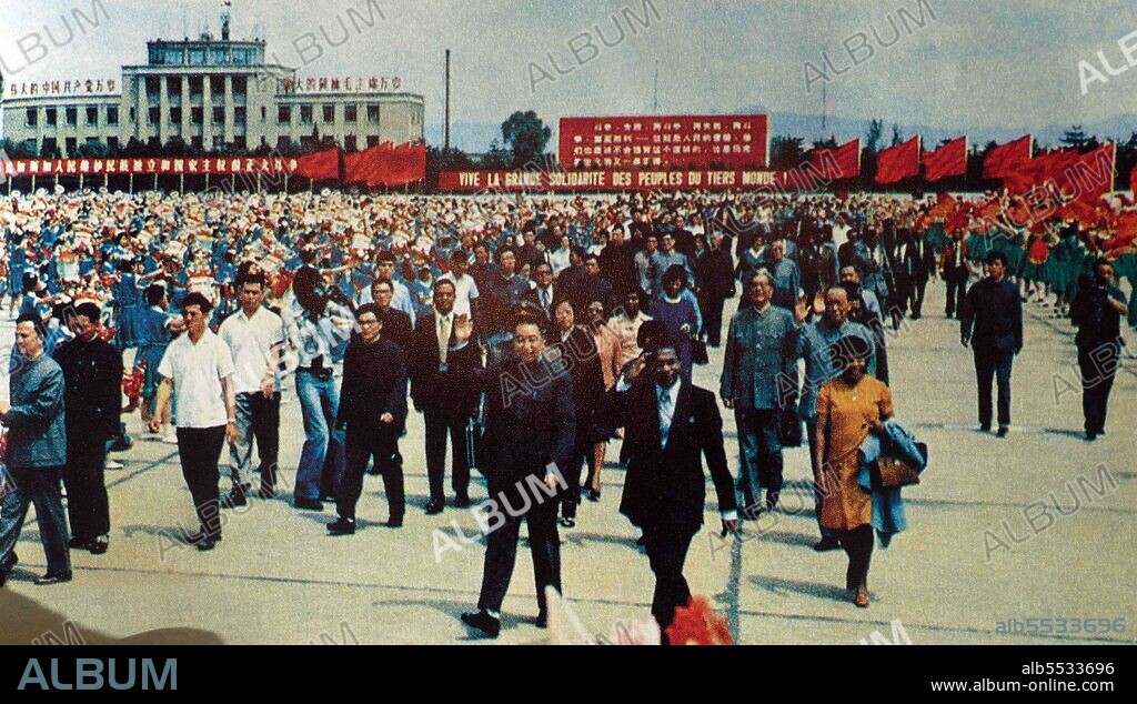 Photos of Chinese Premier Hua Guofeng visiting a farm to examine agricultural advances, in 1975, and greeting the visiting President Didier Ignace Ratsiraka of the Democratic Republic of Madagascar.