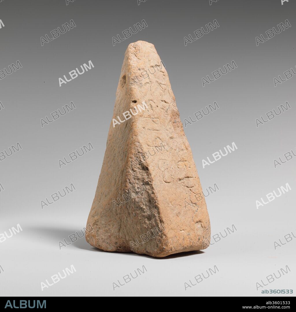Terracotta loom weight. Culture: Greek, Cretan. Dimensions: 4 3/4 in. x 2 1/2 in. (12 cm x 6.3 cm). Date: 6th century or later.
In the form of a truncated pyramid.