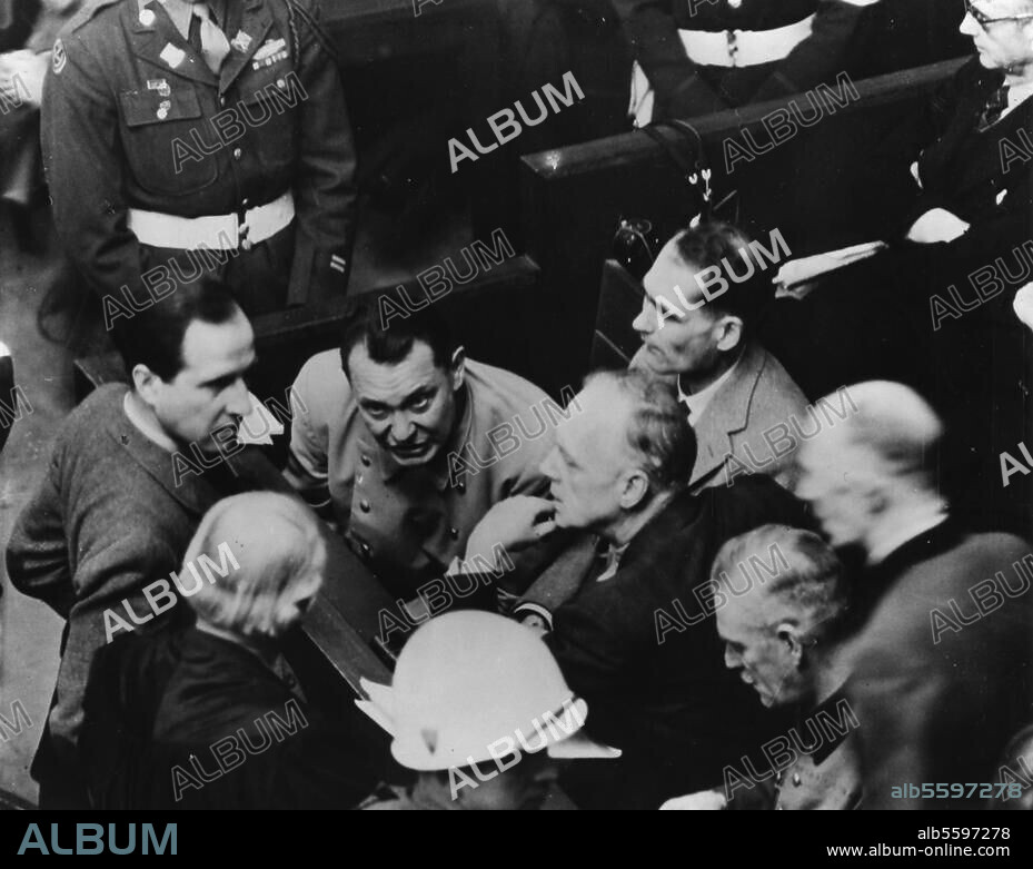 Germany: Post-war period / Nuremberg Trials at the allied military tribunal. (20.11.1945-1.10.1946). - The defendants during a break in the trial in the Justizpalast: Goering (centre), talking to Otto Nelte, Keitel's defence lawyer; beside Goering from left to right Hess, Ribbentrop, Keitel and Jodl. Photo, 7 February 1946.