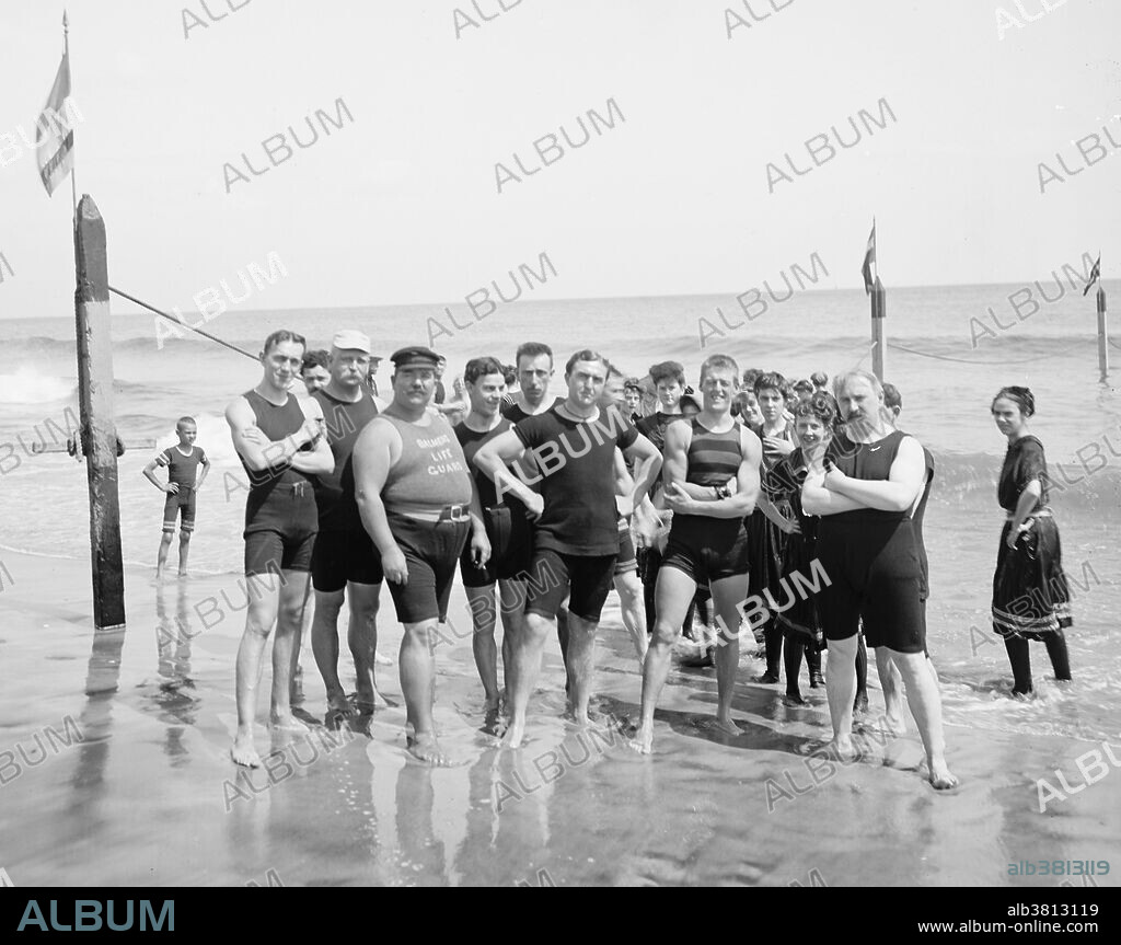 Captain Riley and lifeguards. Due to Coney Island's proximity to Manhattan and other boroughs it began attracting vacationers in the 1830s and 1840s. Between about 1880 and WWII, Coney Island was the largest amusement area in the United States, attracting several million visitors per year. At its height, it contained three competing major amusement parks, Luna Park, Dreamland, and Steeplechase Park, as well as many independent amusements. When the Brooklyn Rapid Transit Company electrified the steam railroads and connected Brooklyn to Manhattan via the Brooklyn Bridge at the beginning of the 20th century, Coney Island turned rapidly from a resort to an accessible location for day-trippers seeking to escape the summer heat in New York City's tenements. Photographed by the Detroit Publishing Company, 1900-05.