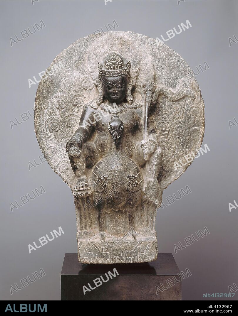 Kumara, the Youthful God of War on his Peacock Mount. Nepal; Kathmandu Valley. Date: 701 AD-900 AD. Dimensions: 57.6 x 43.4 x 12.8 cm (22 11/16 x 17 1/8 x 5 1/16 in.). Gray schist. Origin: Kathmandu Valley.