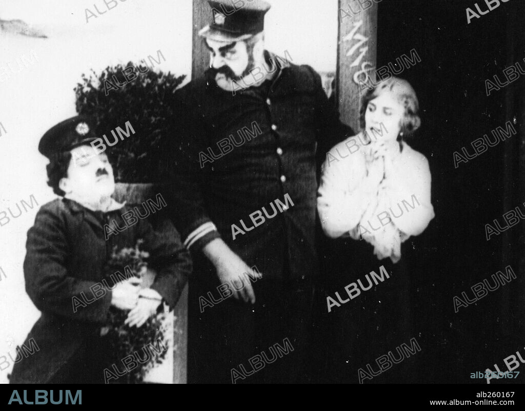 CHARLIE CHAPLIN, EDNA PURVIANCE and ERIC CAMPBELL in THE FIREMAN, 1916, directed by CHARLES CHAPLIN. Copyright LONE STAR/MUTUAL FILM.